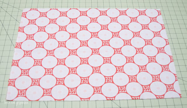 Piece of fabric on cutting mat to make pillow envelope enclosure