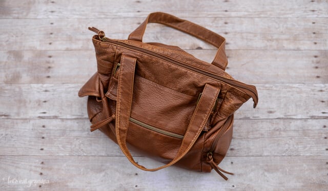 Brown handbag on wooden ground