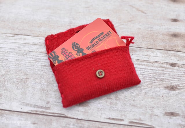 gift cards peeking through a red purse
