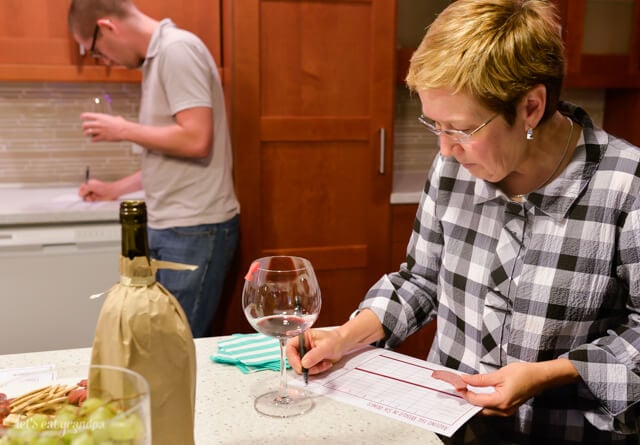 woman filling out form at wine tasting party