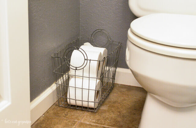 toilet paper storage in finished 1980s bathroom makeover